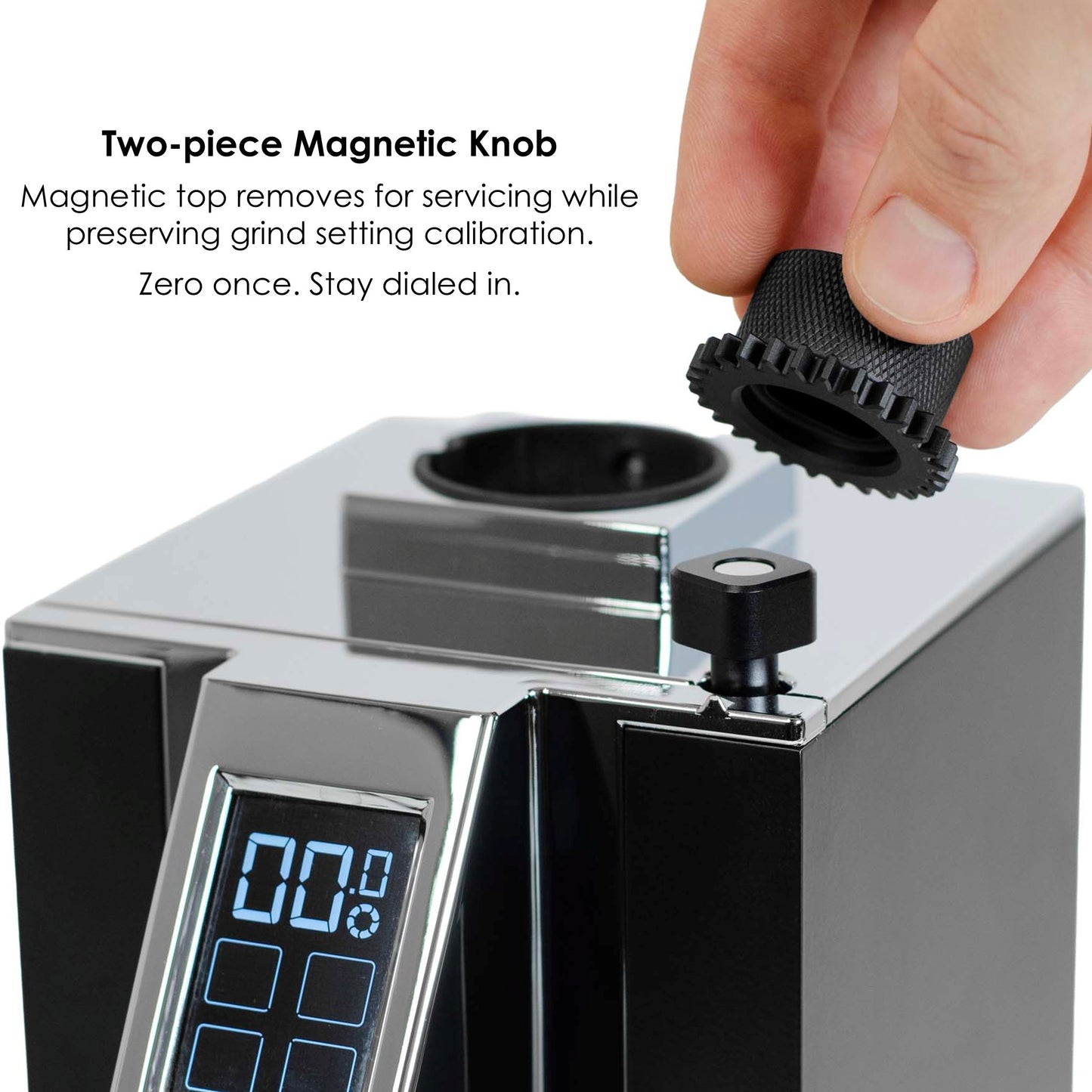 Hand lifting the magnetic top knob off a Eureka Mignon grinder to remove the dial without changing grind setting.