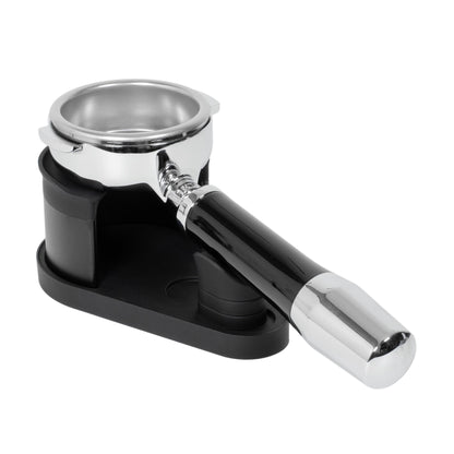 Side angled view of the ARO Adjustable Puck Prep Stand with a spouted portafilter installed, illustrating balanced support between the basket rest and magnetic handle saddle.