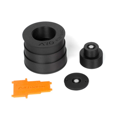 Disassembled view of the ARO telescoping dosing stand showing the outer body, internal center column, base cap with magnet, and the included orange adjustment tool.