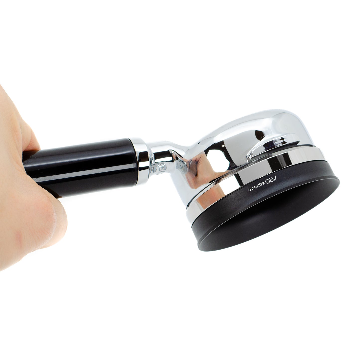 Hand holding a portafilter upside down showing the ARO PortaFunnel attached, highlighting the secure magnetic connection and premium materials.